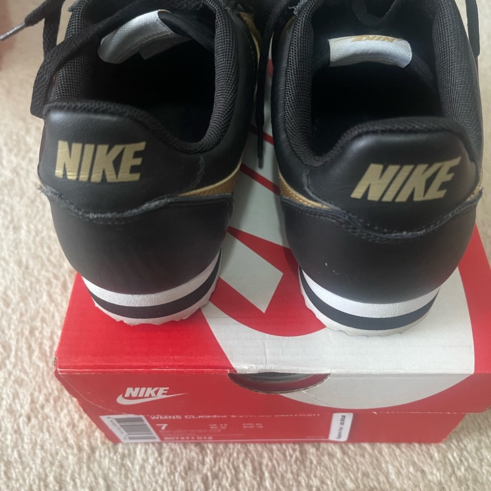 Nike Black and Gold Athletic Shoes